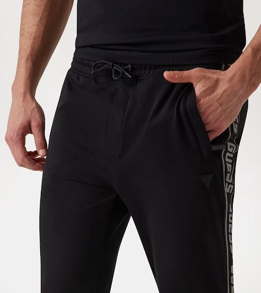 PANTALONI JOGGER GUESS BANDE LATERALI LOGO NERO