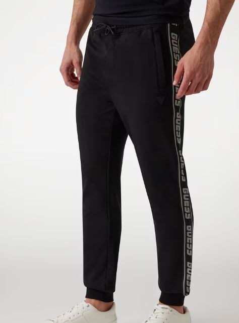 PANTALONI JOGGER GUESS BANDE LATERALI LOGO NERO