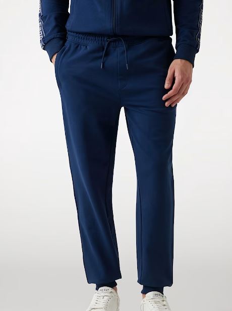 PANTALONI JOGGER GUESS BANDE LATERALI LOGO BLU